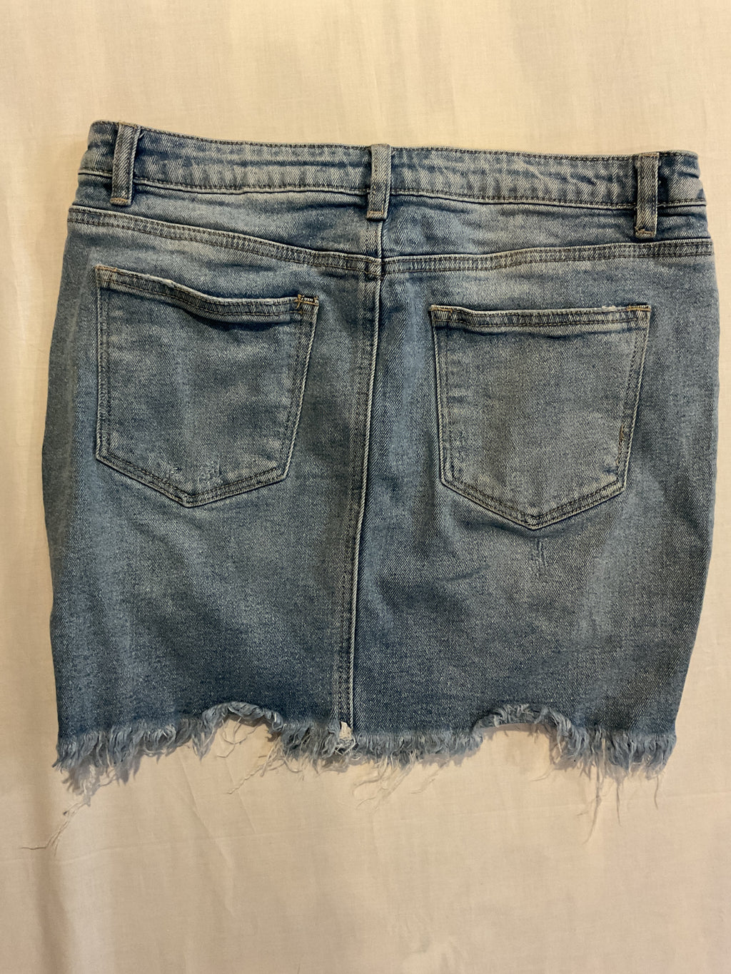 Denim mini skirt, distressed.